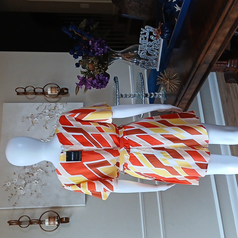 New Vibrant Orange and Yellow Patterned Wrap Mini Rorper. Size L - Picture 12 of 17
